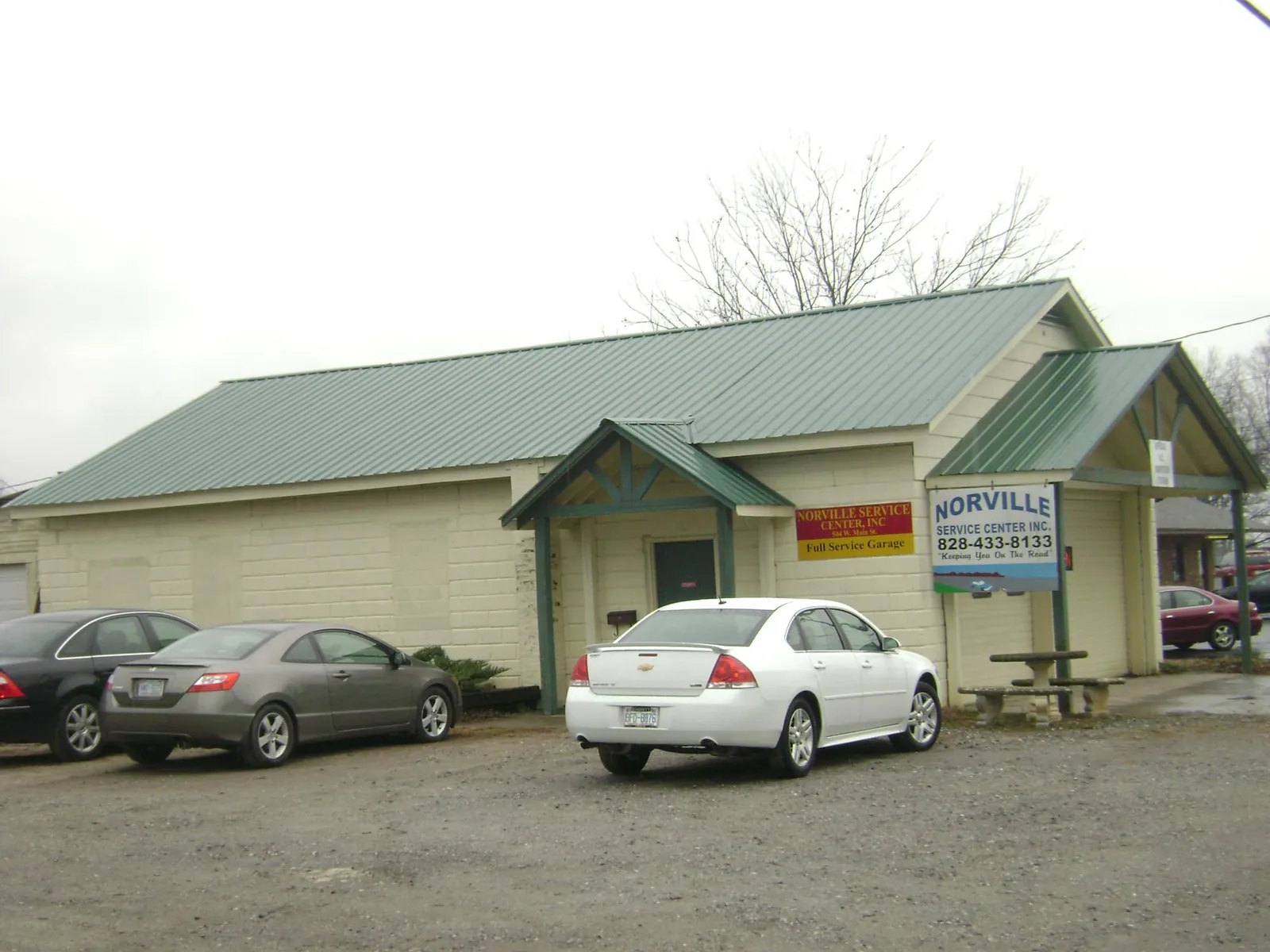 Green metal roof on a service garage with a covered entry in New Windsor